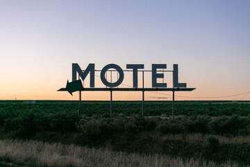 Retro motel sign at sunrise