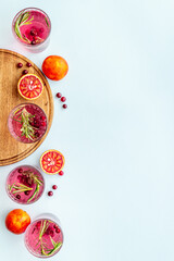 Citrus juice and slices of grapefruit and red oranges. Overhead view