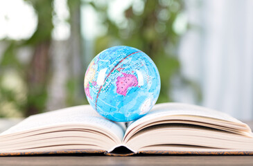 Open book and globe