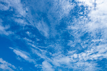 Fototapeta na wymiar beautiful blue sky with white clouds in the noon time horizontal composition