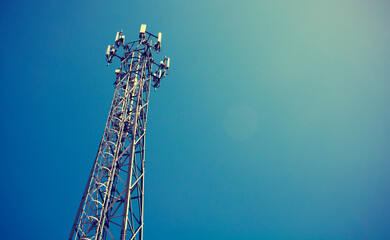 Telecom mast or Telecommunication mast TV antennas wireless technology with blue sky background,...