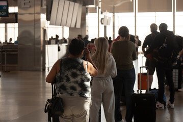 Airline passengers stand in long lines for check in on Memorial Day weekend at RDU International...