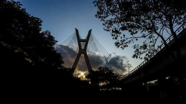 Timelapse view of the Octavio Frias de Oliveira cable-stayed bridge, or Ponte Estaiada, in Sao Paulo, Brazil, with sunset clouds sky