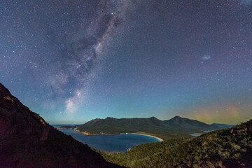 Milky Way and Aurora Australis over moonlit Wineglass Bay, Tasmania