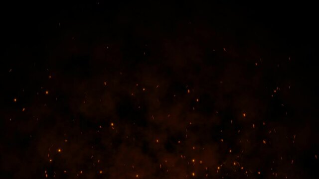 Shot of flying fire sparks in the air on dark black background. 4k