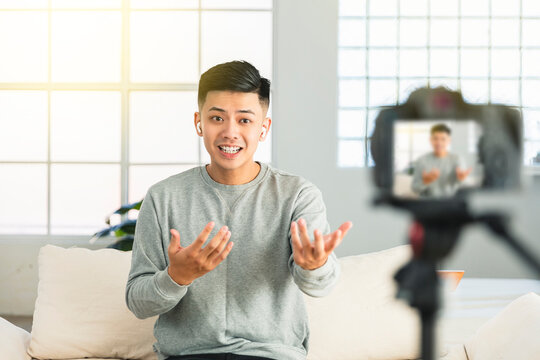 Young man recording video for an internet tv show or tutorial streaming