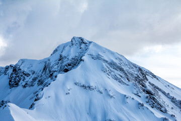 A high mountain peak covered with snow