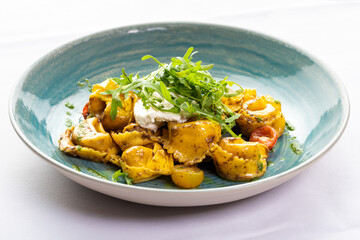 Tortellini with truffle sauce and arugula