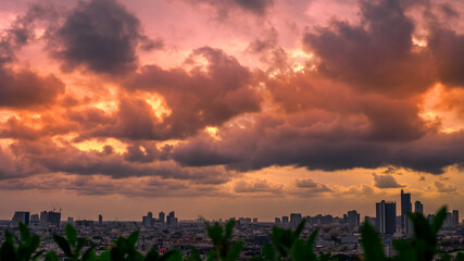 The blurred abstract background of the morning sun exposure to the tiny dust particles that surround the tall buildings in the capital, the long-term health issue of pollution