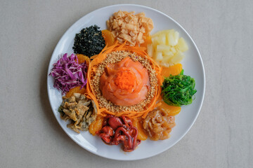 Delicious and colorful display of Chinese prosperity cuisine / Yee Sang aka Prosperity Toss /...