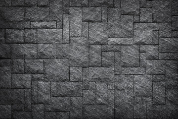 Dark grey slate stone or black stone wall texture blackground