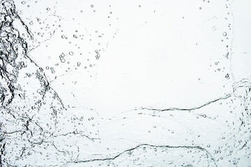 Background texture of water falling on the glass