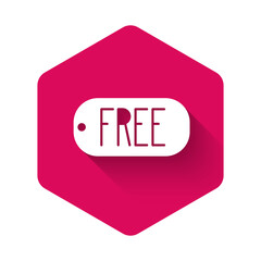 White Price tag with an inscription Free icon isolated with long shadow. Badge for price. Promo tag discount. Pink hexagon button. Vector Illustration