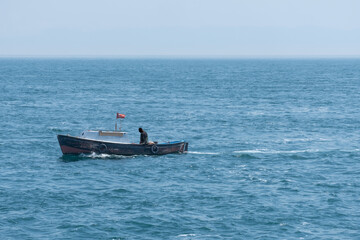 small fishing boat in the sea and fisherman, yacht,