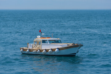 Fototapeta premium small fishing boat in the sea and fisherman, yacht,