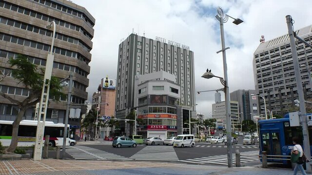 NAHA, OKINAWA, JAPAN - MAY 2021 : View around central downtown area Kokusaidori street. Busy touristic area in Okinawa. Many souvenir shop, restaurant and bar at the street.