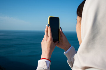 Man takes pictures on the phone