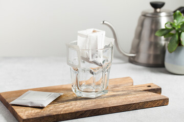 Obraz na płótnie Canvas Drip coffee bag in a mug. Trends in brewing coffee at home.