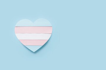 Flag of transgender in shape of heart on color background