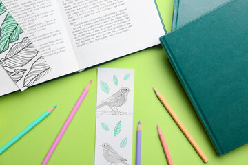 Cute bookmarks with books and pencils on color background
