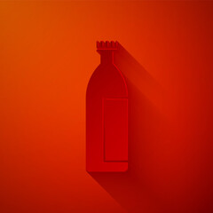 Paper cut Cream or lotion cosmetic tube icon isolated on red background. Body care products for men. Paper art style. Vector Illustration