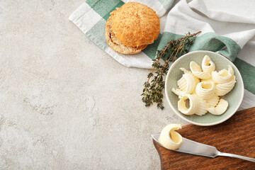 Composition with butter and bread on light background