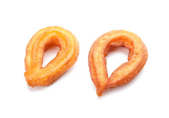 Tasty churros on white background