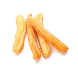 Tasty churros on white background