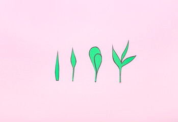 Paper sprouts on color background. Ecology concept