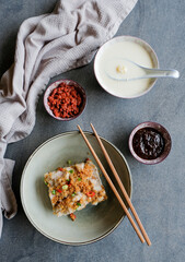 Popular homemade Chinese cuisine / Yam Cake with Gingko Barley dried Beancurd Skin Sweet Soup / Rice flour mixed with ground pork and garnished with dried shrimps, scallions, soy and chili paste sauce