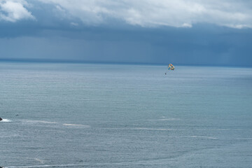 Fototapeta na wymiar Beautiful aerial view of Paragliding in the beach of Manuel Antonio Quepos in Costa Rica