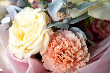 bouquet of the pastel color flowers, yellow, white and pink.roses and carnations