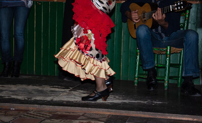 flamenco dancer on traditional wooden table - obrazy, fototapety, plakaty