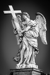 Statue of an Angel with the Cross on Sant'Angelo Bridge in Rome, Italy