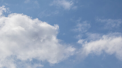 Background of blue sky with white clouds