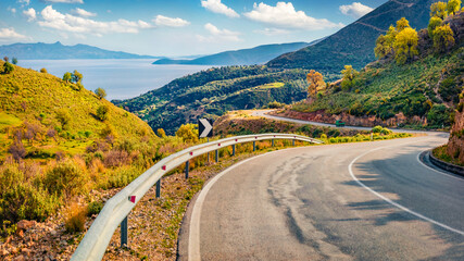 Typical Albanian view of Adriatic shore with empty asphalt road. Picturesque summer day in Albania,...