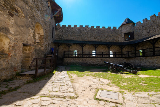 Stara Lubovna, Slovakia - 28 AUG 2016: ancient cannon in the inner courtyard of the castle. great stone walls of a fortrece. popular travel destination