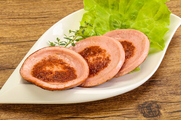 Roasted sausage slice in the plate