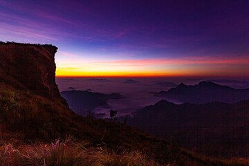 Beautiful landscape nature on peak mountain with sunrise in winter at viewpoint Phu Chi Fa