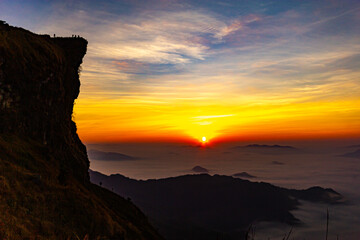 Beautiful landscape nature on peak mountain with sunrise in winter at viewpoint Phu Chi Fa