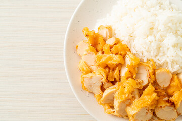 fried chicken topped rice with dipping sauce