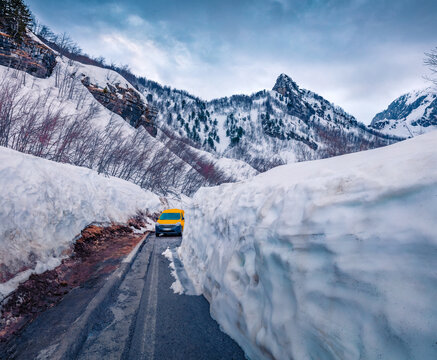 Huge snowdrifts blocked the road to the mountains. Fantastic spring scene of Theth National Park, Albania, Europe. Aprin in Albanian highlands. Traveling concept background..