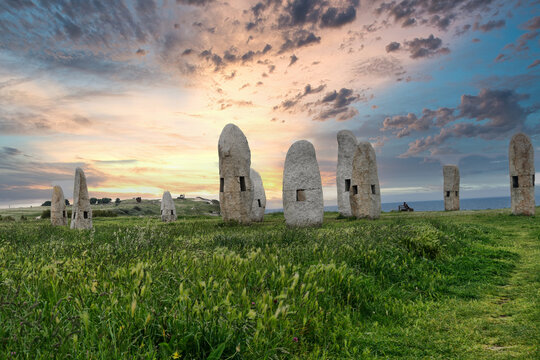 Menhires Pola Paz in a field under the sunlight during the sunrise in Spain