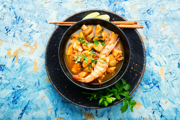 Tom yum soup with seafood and coconut milk