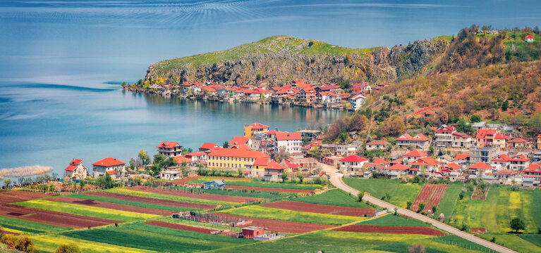 Panoramic spring cityscape of Lin town. Sunny morning scene of Ohrid lake. Picturesque outdoor scene of Albania, Europe. Traveling concept background..