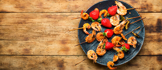 Grilled shrimps on skewers with strawberries,BBQ shrimp