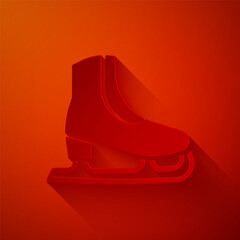 Paper cut Skates icon isolated on red background. Ice skate shoes icon. Sport boots with blades. Paper art style. Vector