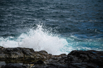 waves crashing on rocks