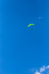 paragliding in the blue sky