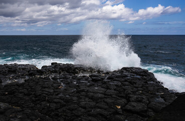 waves crashing on rocks